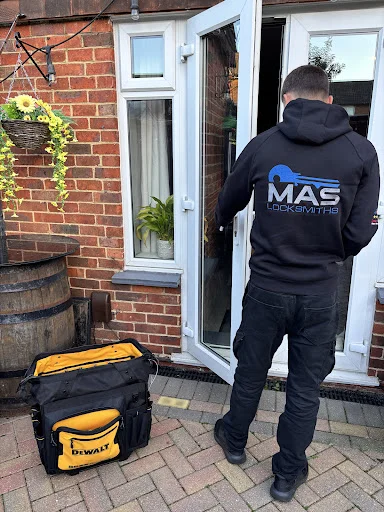 Mason from MAS Locksmiths arriving at a job with his tool bag